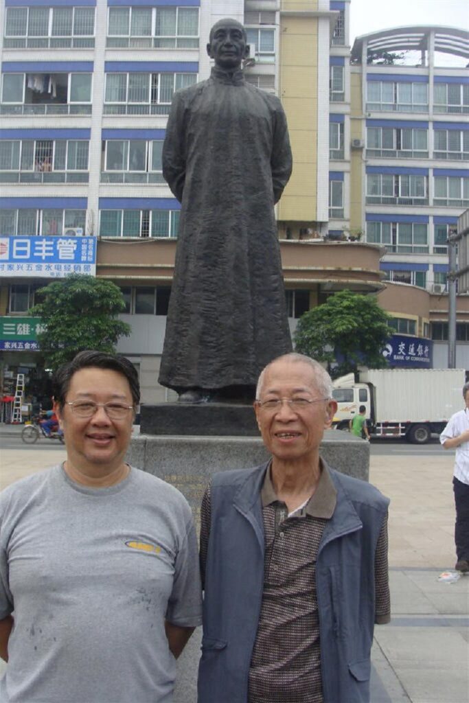 Sifus Posing with a Wing Chun Master Statue